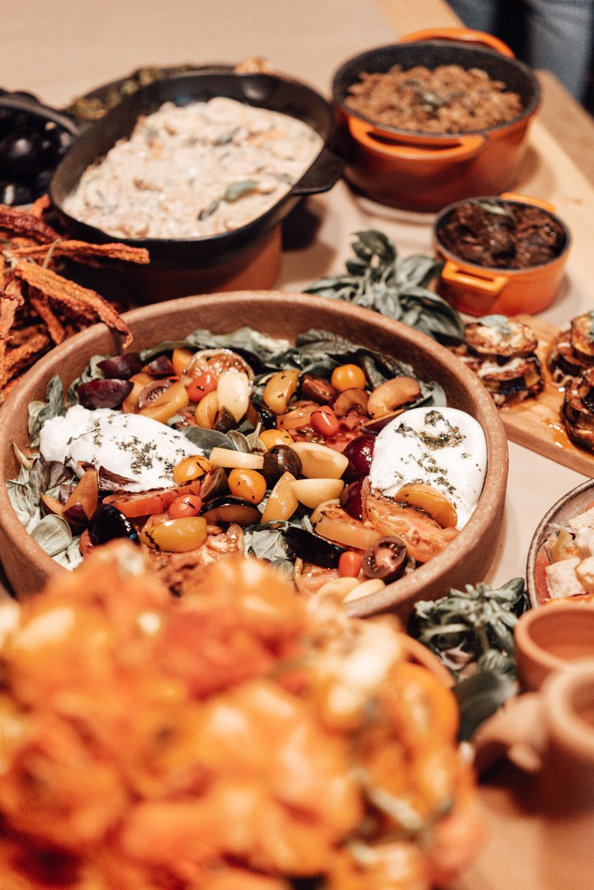 Fresh local culinary spread on an outdoor rustic dining table